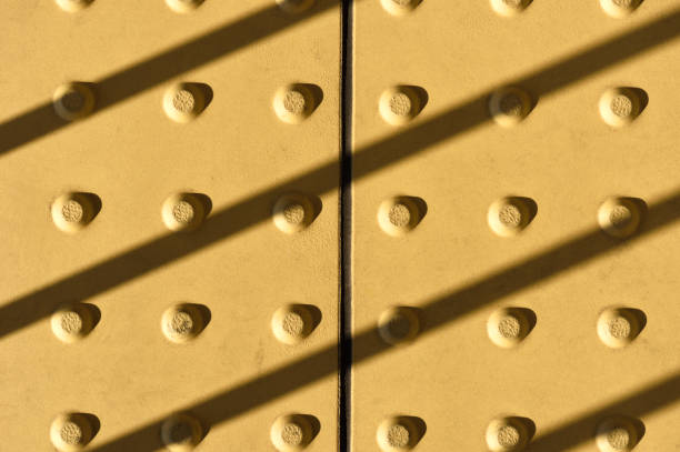 Yellow dot walkway and blind safety on pavement and footpaths.