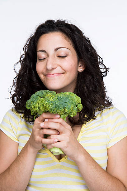 Women enjoying broccoli