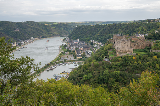 Sankt Goar, Germany - October 3, 2021: Panoramic image of Sankt Goar with Rheinfels castle against cloudy sky on October 3, 2021 in the Rhine Valley, Rhineland-Palatinate, Germany