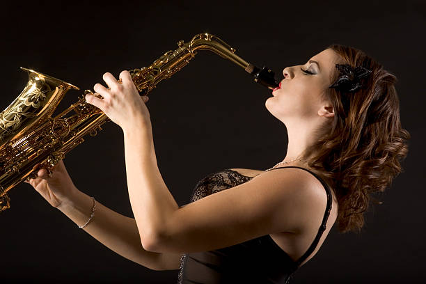 istock Retro female saxophonist 145052574