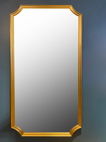 Gold frame full length mirror hanging on the wall with light reflection (Frame with Clipping Path)