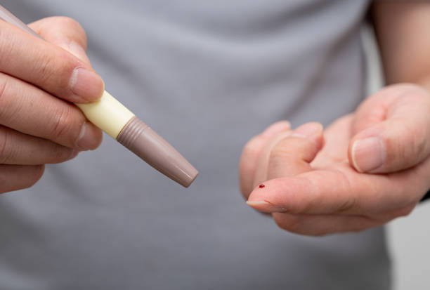 istock Man measures his blood sugar. Glucometer, blood sample test, diabetes concept. 1450536533