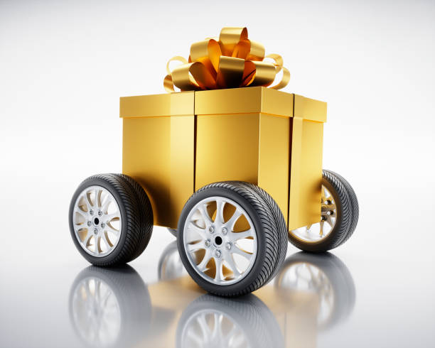 istock Golden Gift Box on car wheels 1450537026