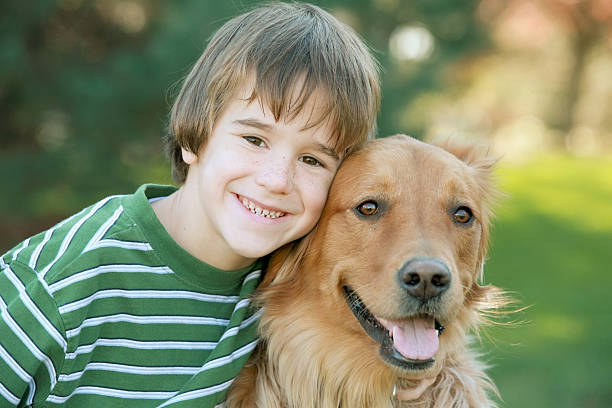 istock Boy with Golden Retriever 145053840