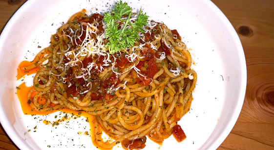 Delicious Spaghetti Bolognese, Pasta with meat, tuna, and tomato sauce and vegetables american italian cuisine