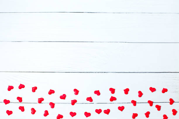 istock Red hearts border on white wooden background. Valentines Day background. copy space 1450542492