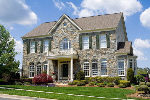 Well landscaped stone single family house.  Home is a center hall colonial in suburban Maryland, United States.  - see my lightbox for more house images.  