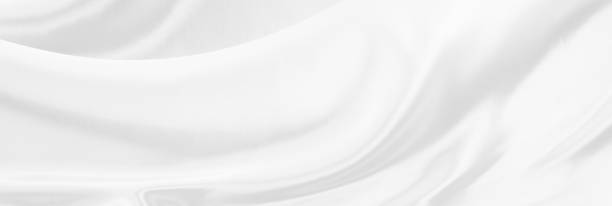 istock White gray satin texture that is white silver fabric silk panoramic background with beautiful soft blur pattern natural. 1450545527