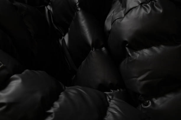 istock background of a black puffer jacket close up 1450546381