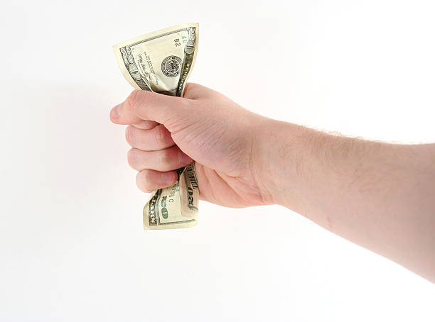 Squeezing Cash stock photo