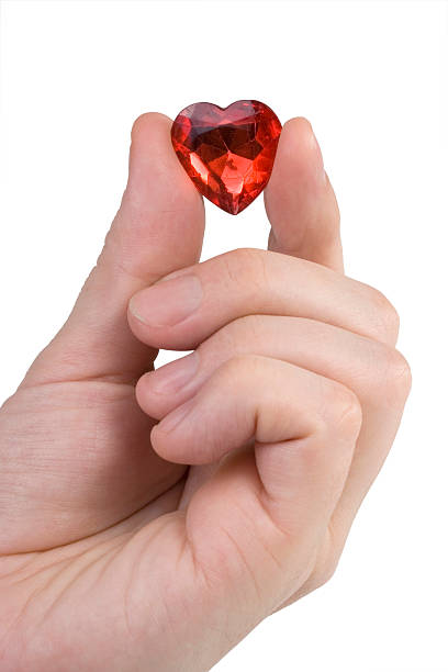 istock Male hand holds glass red heart 145055109