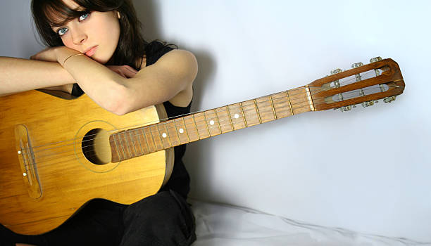 Pretty girl with guitar stock photo