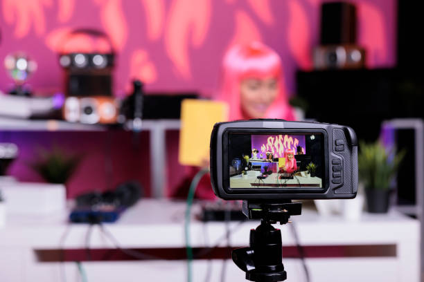 istock Asian vlogger showing notebook at camera while recording school supplies review talking with subscribers 1450555331