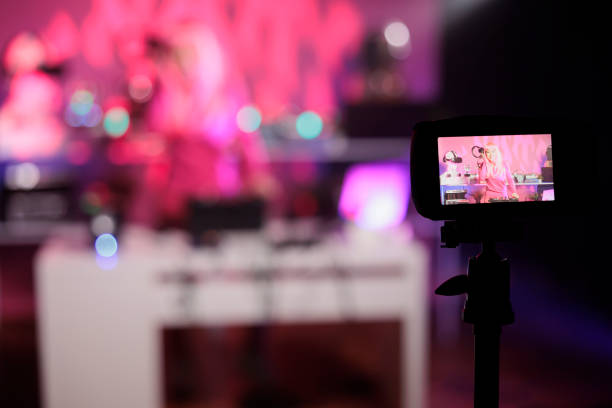 istock Professional recording camera filming dj artist playing techno music at mixer console having fun 1450555366