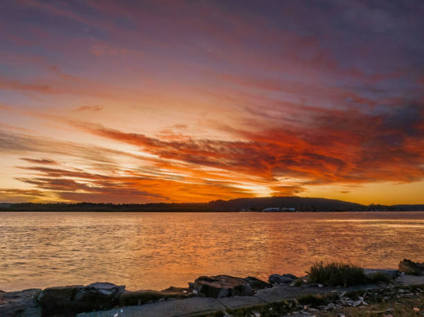 istock High cloud sunrise at the waterfront 1450555735