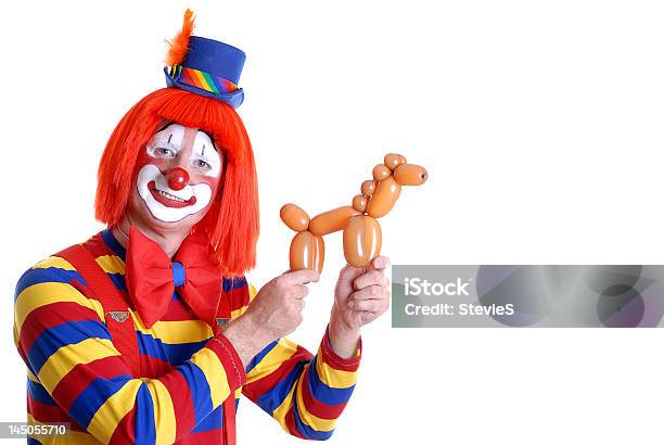 Circus Clown Displaying A Horse Balloon Animal Stock Photo - Download Image Now - Clown, Balloon, Balloon Animal