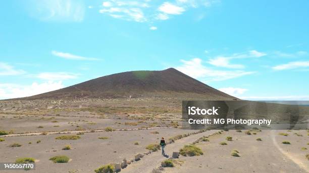 Aerial View Of A Tourist Hiker Walking At Montaña Roja Tenerife Canary Islands Drone Shot Stock Photo - Download Image Now