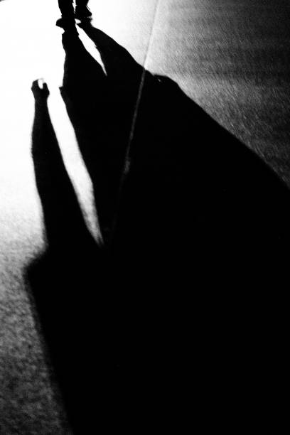 istock shadow of a mysterious person 1450558162