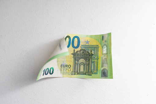 100 Euro banknotes stack formation on white background