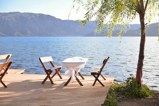 shoot in Luguhu yunnan China, Next to the lake, there are tables and chairs for rest and eating, holidays and tourism