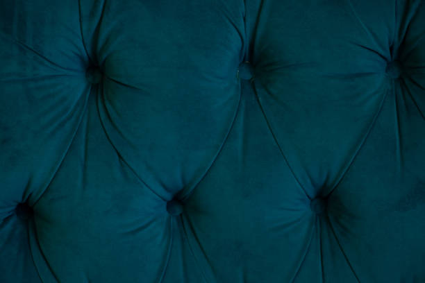 istock background of soft fabric wall with sewn buttons, bed side as background 1450565056