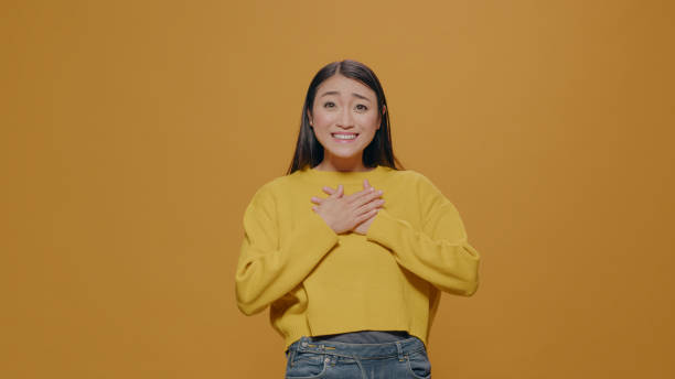 istock Surprised woman with big eyes feeling astonished in studio 1450565996