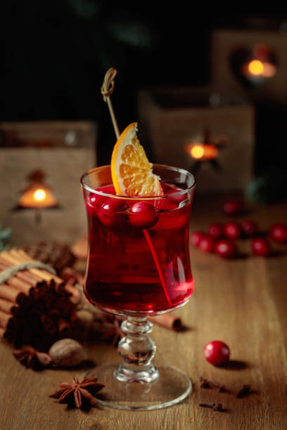 istock Christmas drink with spices, orange, and cranberries. 1450568711