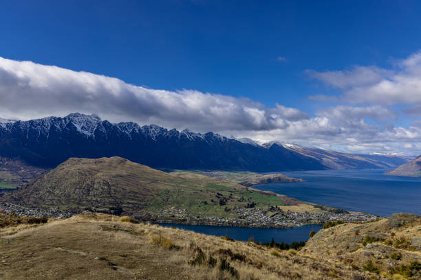 Queenstown, Otago, New Zealand - September 04, 2022: Looking out over Queenstown’s Lake Wakatipu on a bright sunny day from the top of Queenstown Hill.