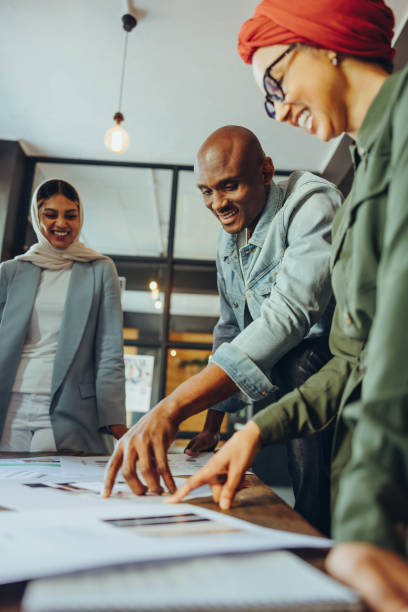 istock Happy designers working together in an office 1450575221