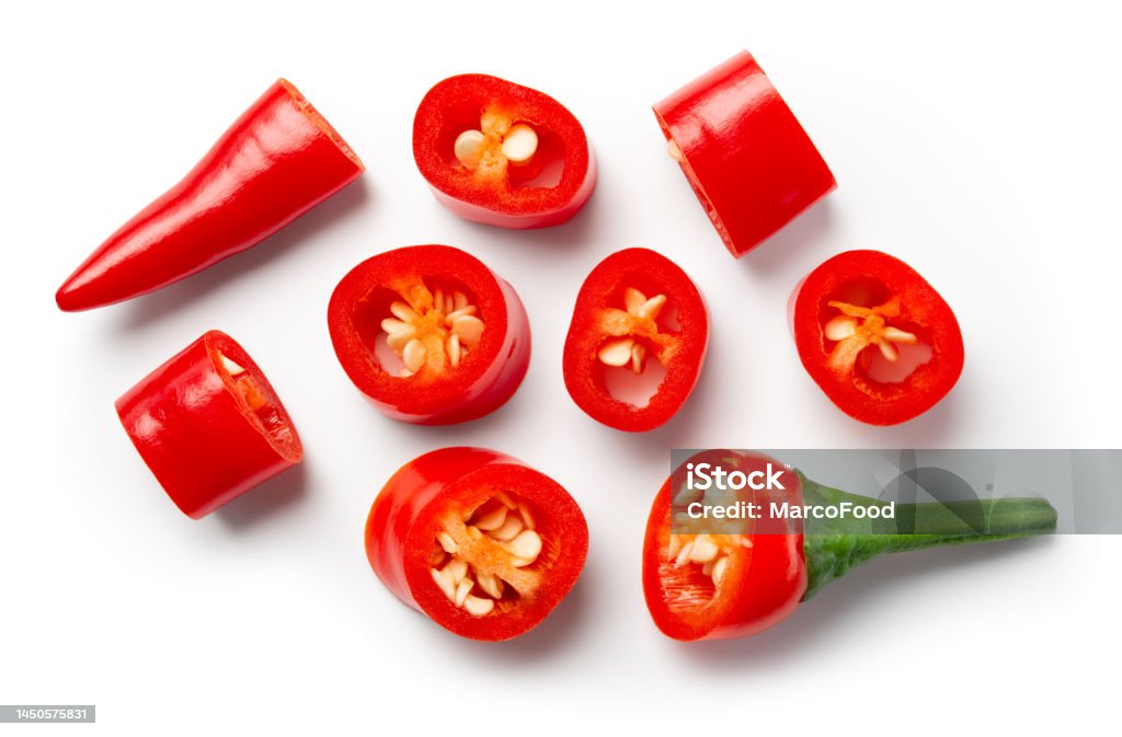 Chili pepper slice isolated. Chilli top view on white background.Cut red hot chili peppers top. With clipping path. Chili Pepper Stock Photo