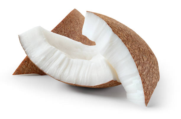 istock Coconut piece isolated. Coconut slice on white background. Broken white coco pieces with clipping path. Full depth of field. 1450577163