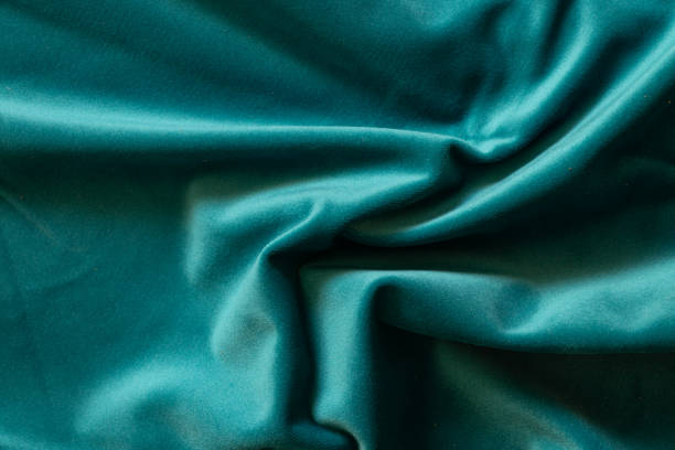 istock plain dark blue crumpled fabric as a background close-up 1450578477