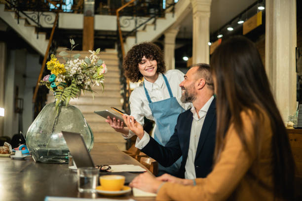 istock Two business people ordering a meal while working together at the restaurant 1450579707