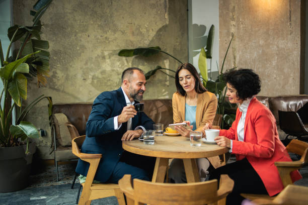 istock Three colleagues enjoying their coffee after a business meeting 1450580556