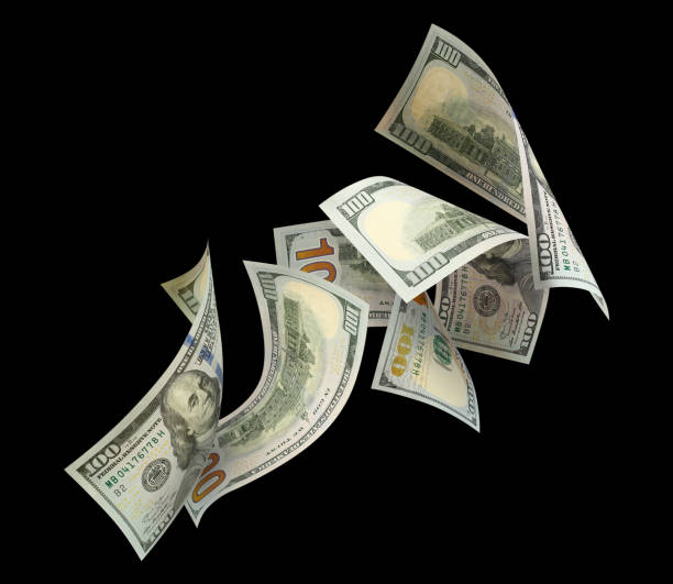 istock Flying 100 American dollars banknotes on black 1450581238