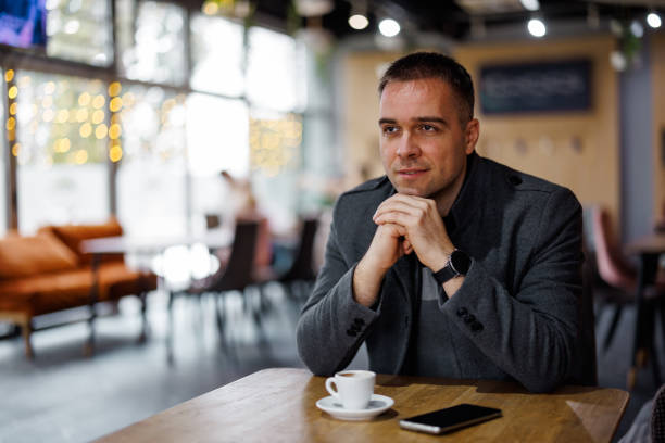 istock Enjoying morning coffee at favorite cafe 1450582473
