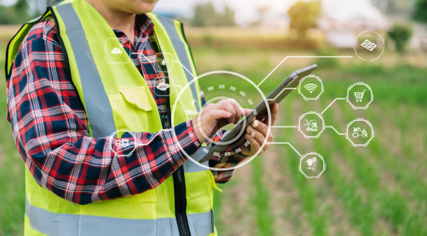istock Smart farmer using application by smartphone concepts modern agricultural technology and visual icon. 1450583927