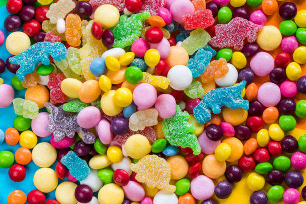istock candy on the colorful table, colorful sweet candy 1450585736