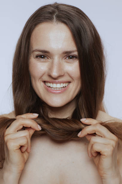 istock smiling young female with long hair 1450589287