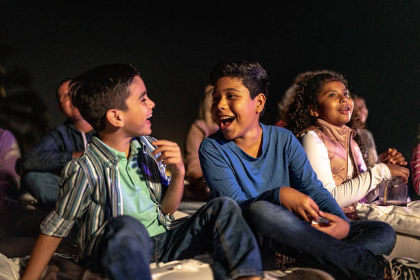 istock Children talking and laughing at the outdoors cinema 1450589977