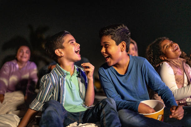 istock Children talking and laughing at the outdoors cinema 1450589982