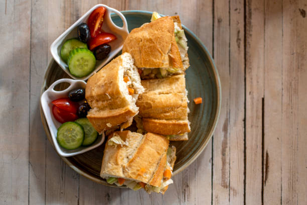istock Sandwich chicken breast and cucumbers and tomatoes 1450591090