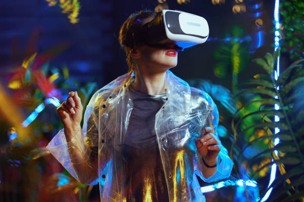 istock excited trendy woman in virtual reality in vr headset exploring 1450591834