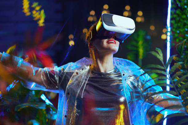 istock happy modern woman with open arms rejoicing in metaverse 1450591844