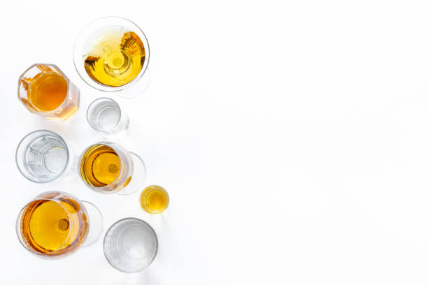 istock Alcohol in glasses with ice. Strong alcoholic drinks background 1450592657