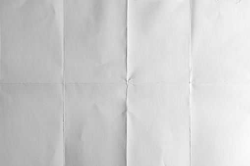 White poster paper folded 3 times
