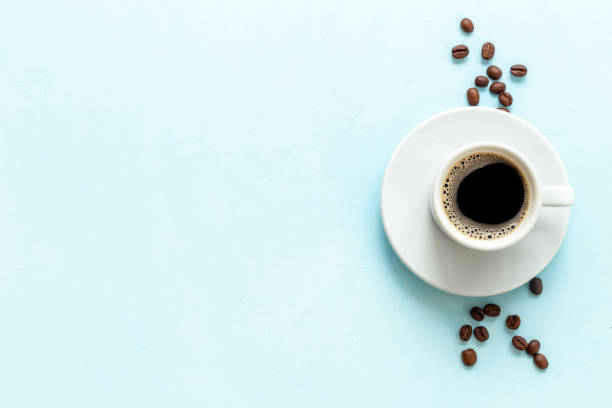 istock Black coffee - espresso - in white cup with coffee beans 1450593111