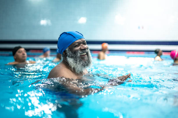 istock Senior man exercising in the swimming pool 1450594686