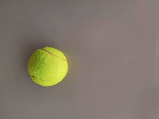 istock tennis ball on ceramic table 1450595504