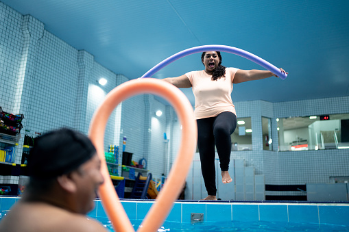 Instructor in an exercise class in the swimming pool